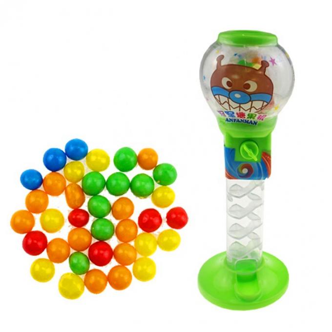 O distribuidor doce das crianças coloridas dadas forma bola do distribuidor dos doces do brinquedo dos doces
